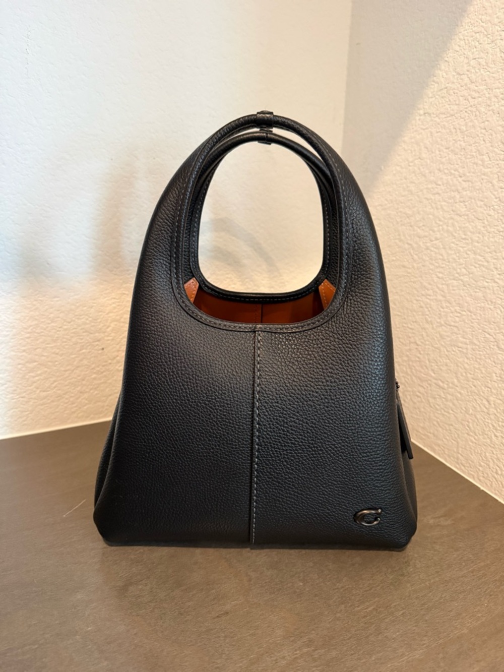 Coach Black Pebble Leather Shoulder Bag with Brown Interior Accent